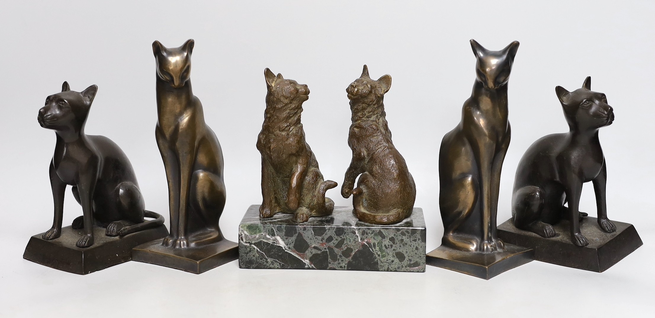 Two bronze cats mounted on a marble base and two pairs of cats (6) tallest 19cms high